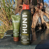 A bottle of HUNT Repellent Lotion and Spray with ducks in the background