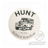 A product photo of the "HUNT Refined Repellent est. 2024" decal from the HUNT Refined Repellent Decal Four Pack. It is a decal featuring the words "HUNT Refined Repellent est. 2024" on a white background. There is a drawing of the company rover in the center.