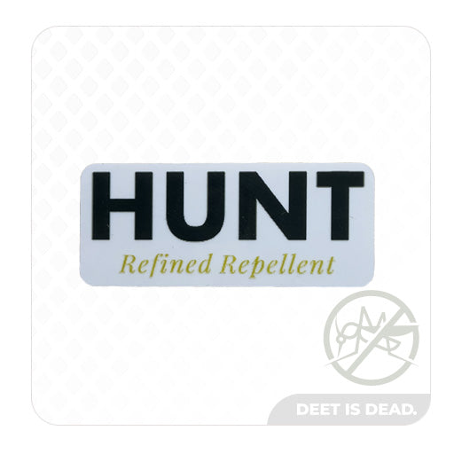 Sticker with "HUNT Refined Repellent" text on a white background.