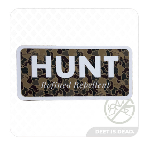 Camouflage sticker with "HUNT Refined Repellent" text.