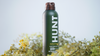 Hunt Refined Repellent Spray bottle with a natural background.
