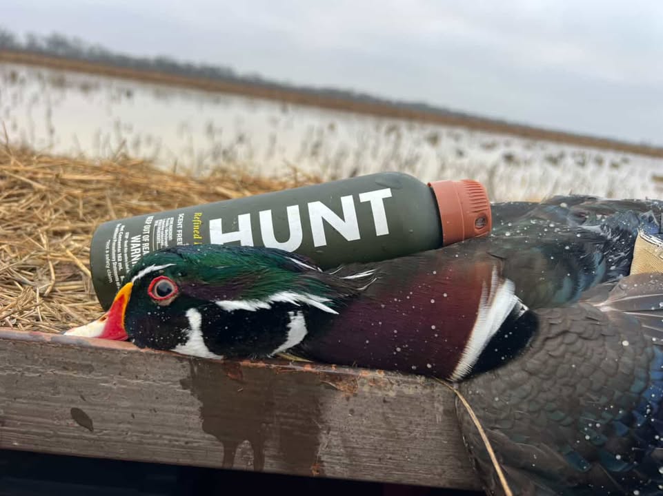A photo of a hunted duck with HUNT Refined Repellent Spray next to it.