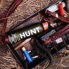 A photo of HUNT Refined Repellent Spray among other hunting equipment.