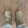 A photo pf muddy boots.